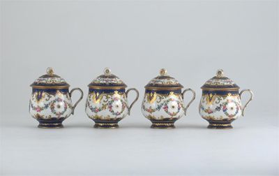 Appraisal: A set of four S vres-style custard cups and covers