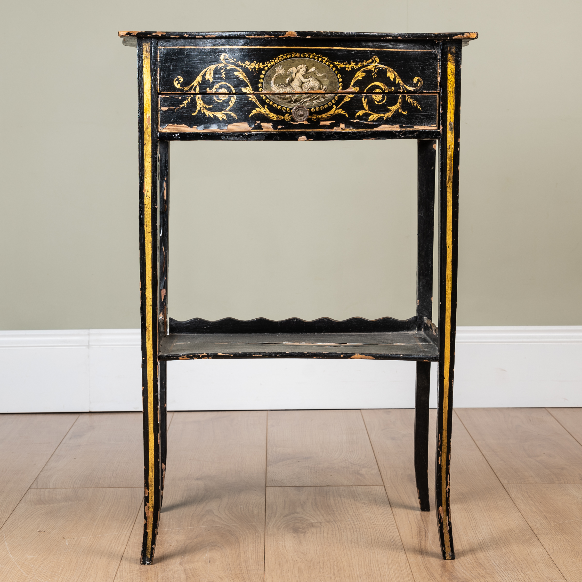 Appraisal: A small lacquered side table with painted decoration overall with