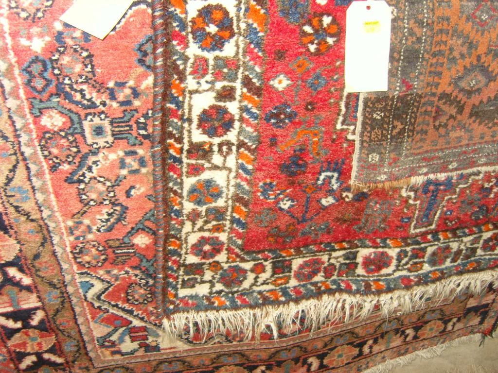 Appraisal: A pink ground eastern wool rug with stylised decoration in