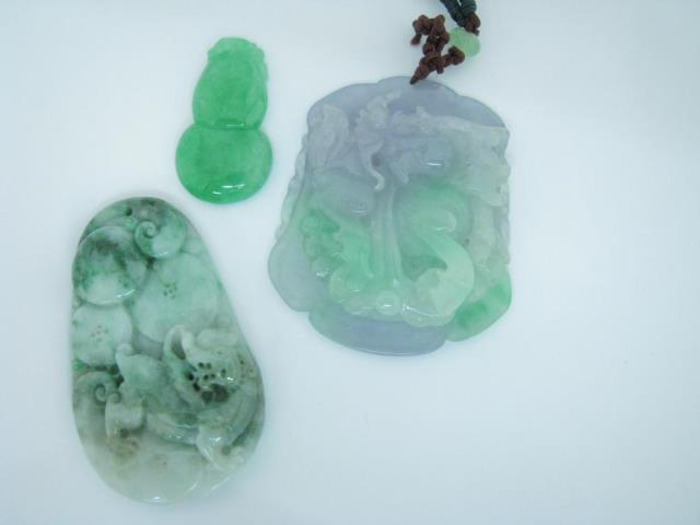 Appraisal: Three carved jade medallions including one dragon motif high with