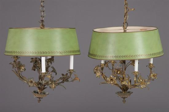 Appraisal: PAIR GILT-METAL FOUR-LIGHT CHANDELIERS th century Each tole shade painted