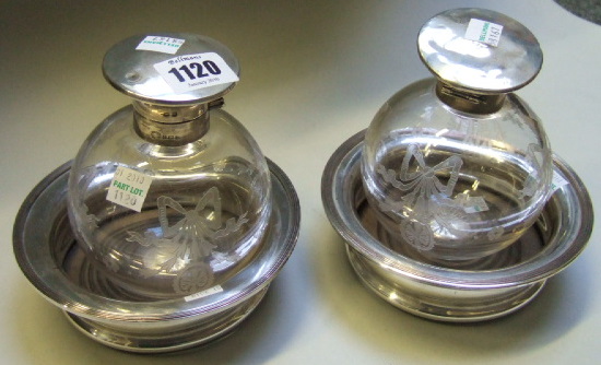 Appraisal: A pair of silver mounted spherical glass hinge lidded scent