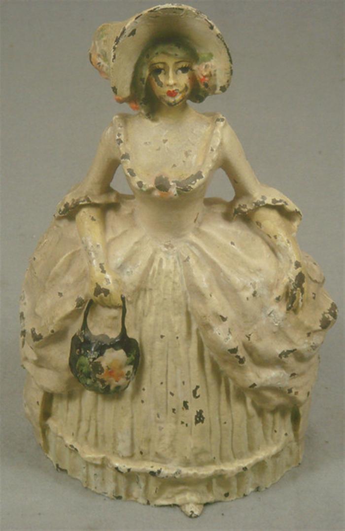 Appraisal: Cast iron doorstop elegant hollow back woman in dress with