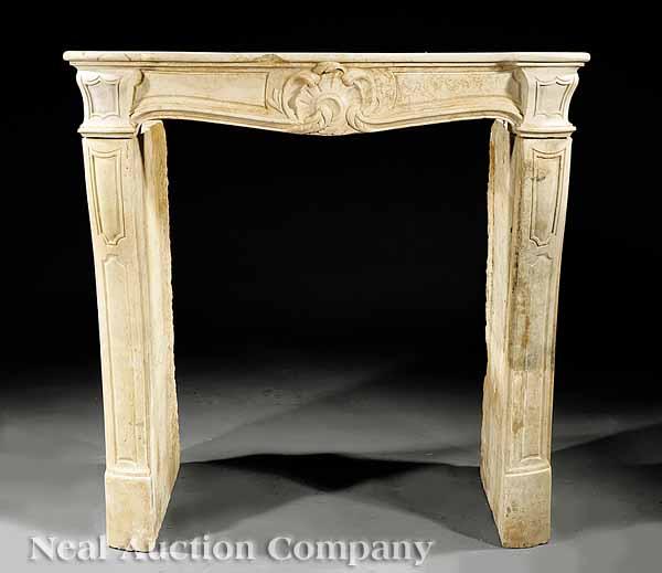 Appraisal: A Diminutive Louis XVI Limestone Mantel asymmetrical central cartouche flanked