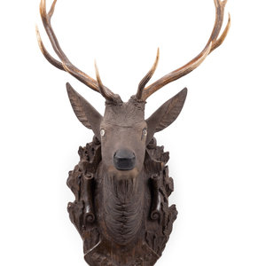 Appraisal: A Black Forest Carved Stag Head th th Century Height