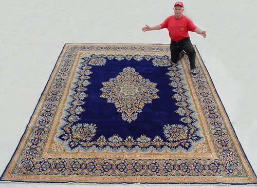 Appraisal: HAND TIED PERSIAN CARPET Rich blue ground approx ' ''