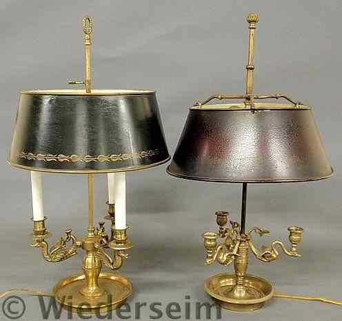 Appraisal: Two similar brass table lamps with flying bird arms and