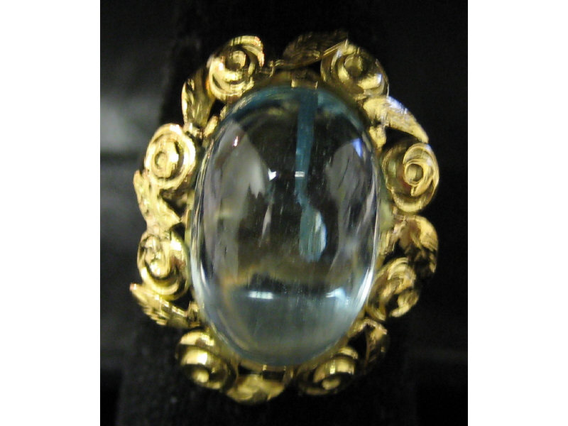 Appraisal: AQUAMARINE RING k yellow gold ring with floral design set