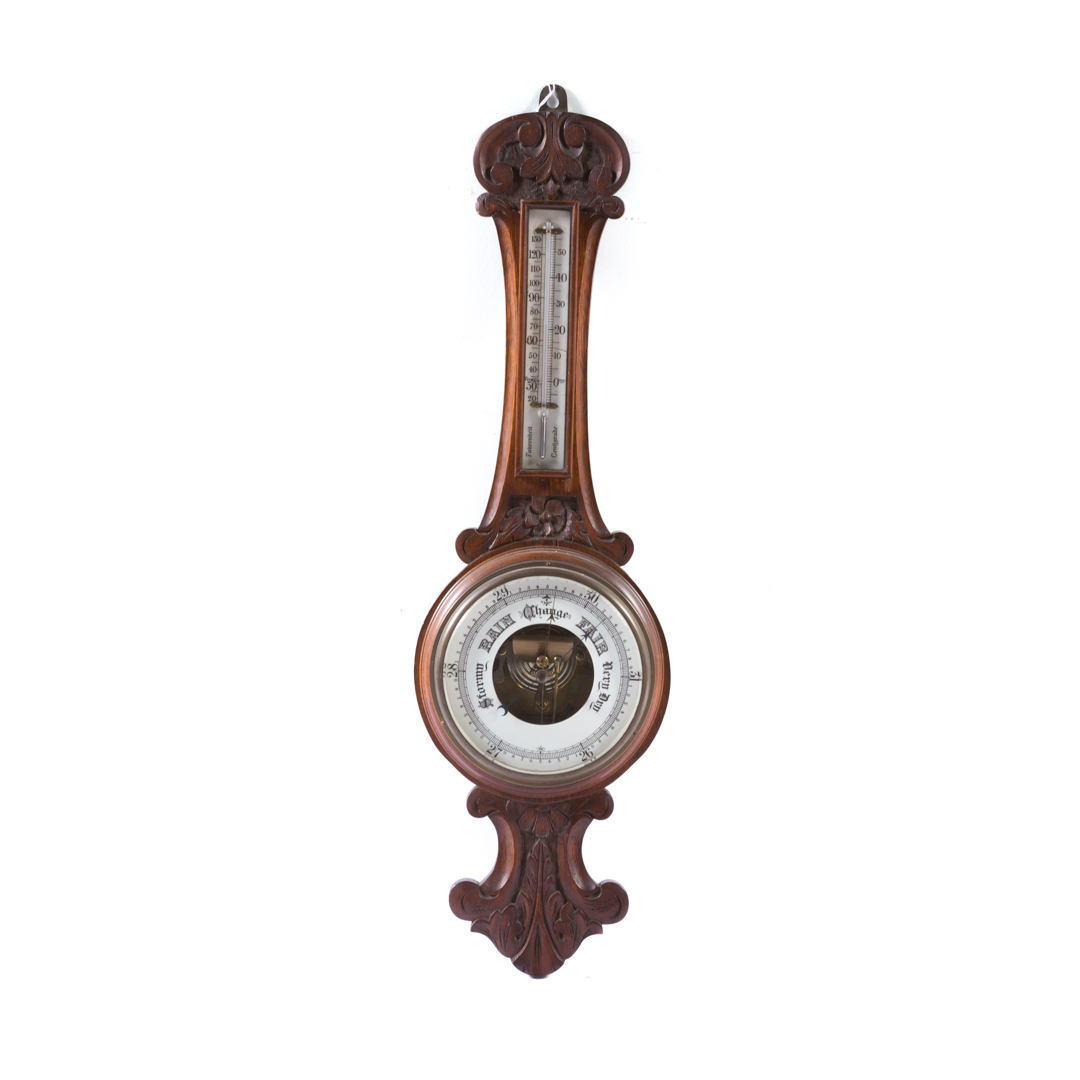 Appraisal: German Black Forest carved walnut barometer early th-century with thermometer