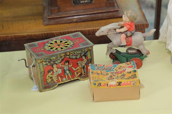 Appraisal: THREE EARLY TOYS Tin lithographed wind-up music box ''h ''l