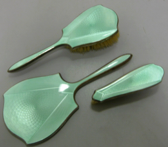 Appraisal: GREEN GUILLOCHE ENAMEL AND SILVER - Three-piece dresser set handled