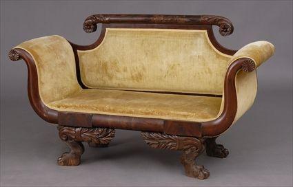 Appraisal: CLASSICAL MAHOGANY SETTEE With a carved cresting above an upholstered