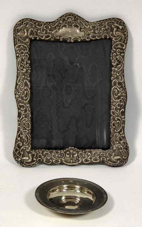 Appraisal: An Edward VII silver rectangular photograph frame the border embossed