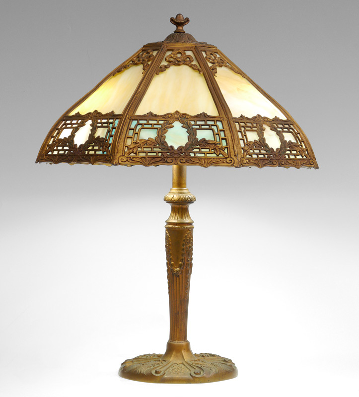 Appraisal: BENT PANEL SLAG GLASS LAMP Patinated gilt cast metal base