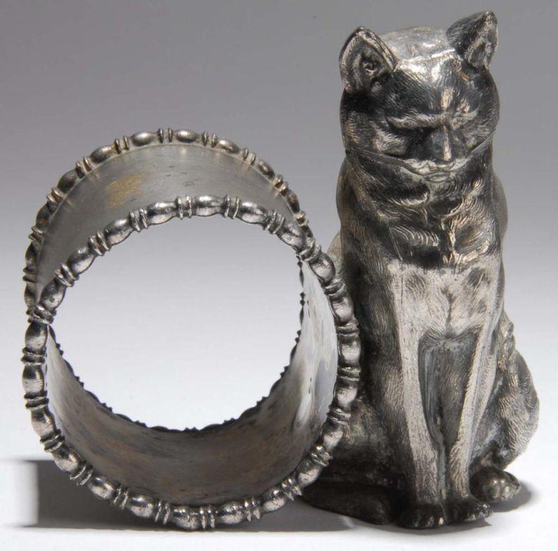 Appraisal: Large Contemplative Cat Figural Napkin Ring Description Cat sits by