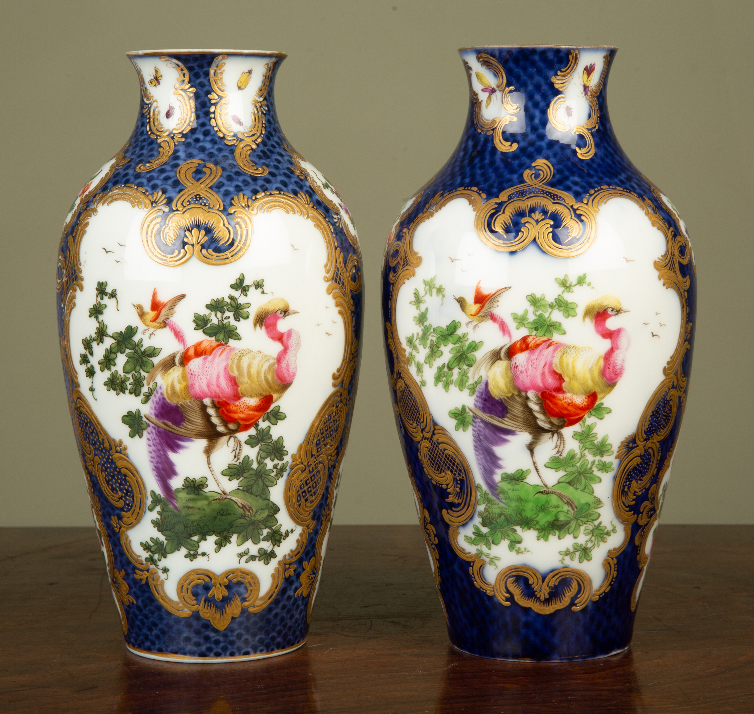 Appraisal: A pair of faux Worcester porcelain baluster vases decorated with