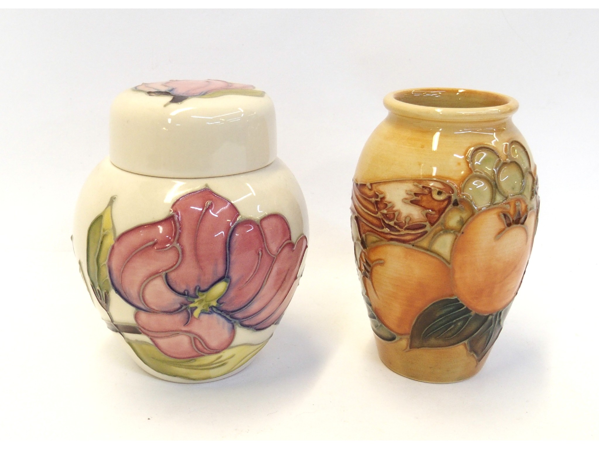 Appraisal: Moorcroft Magnolia pot and cover together with a Moorcroft vase