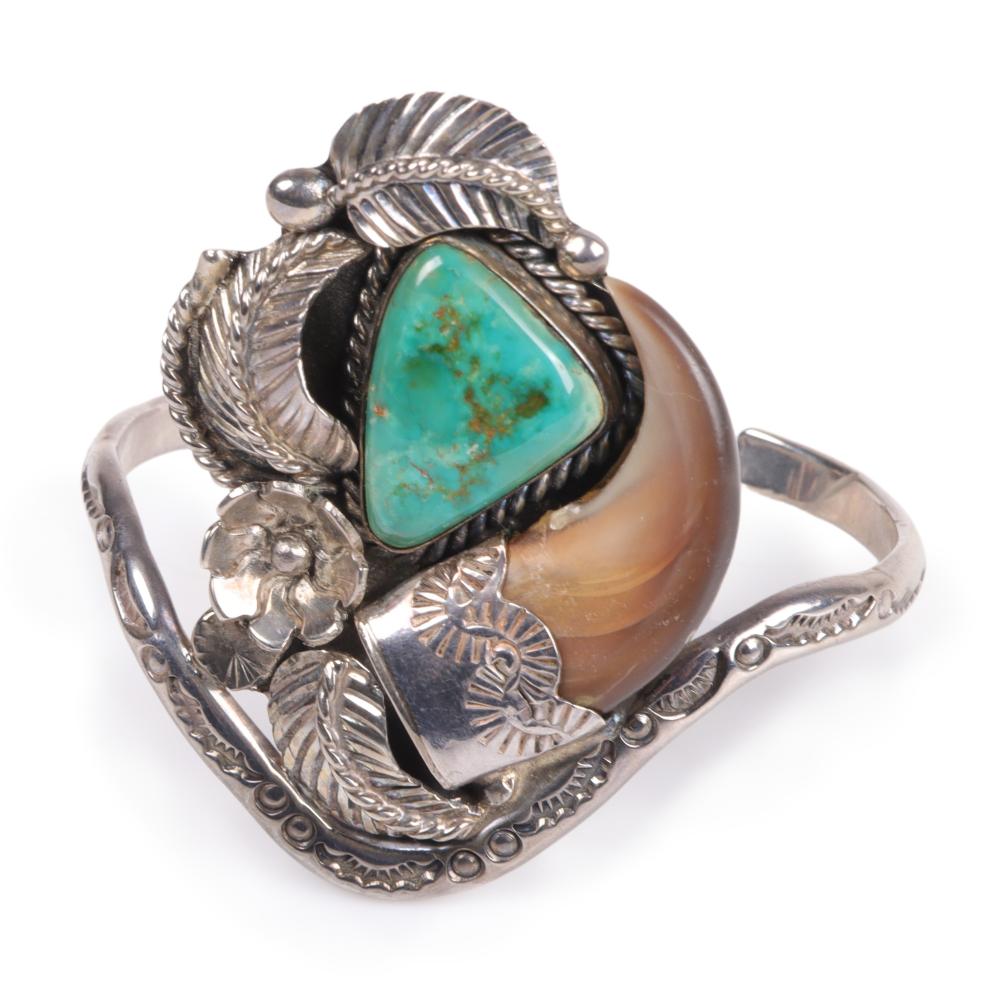 Appraisal: NATIVE AMERICAN STERLING SILVER TURQUOISE AND BEAR CLAW CUFF BRACELET