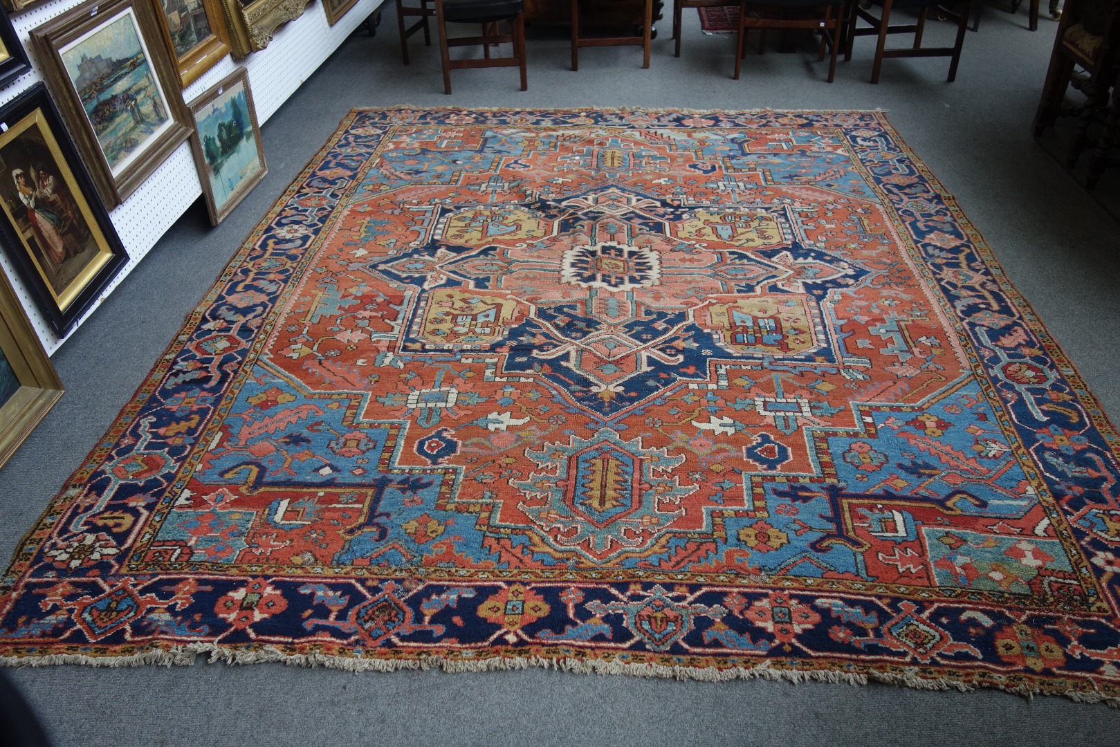 Appraisal: A Heriz carpet Persian the madder field with a bold