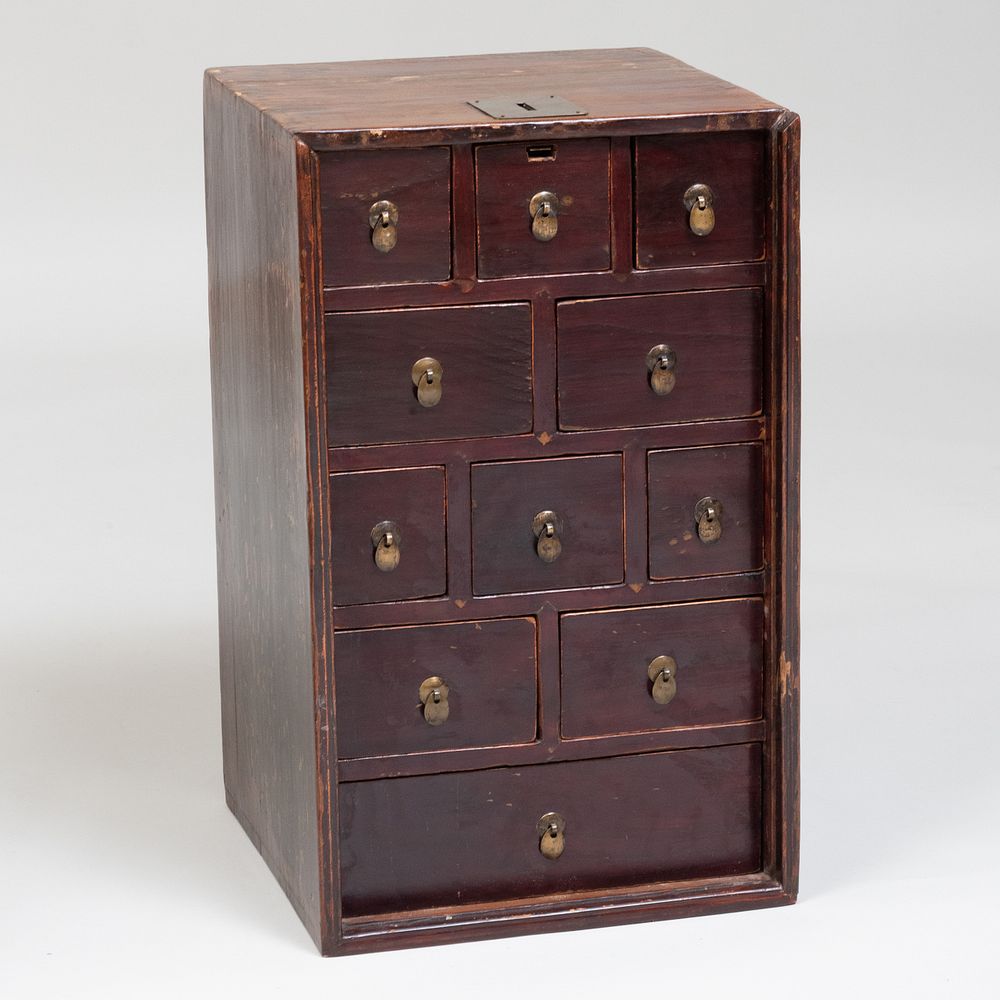 Appraisal: Chinese Stained Pine Single Door Cabinet With a locking mechanism