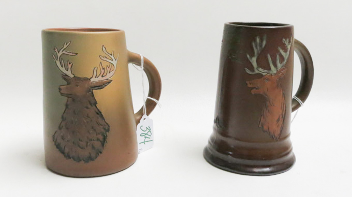 Appraisal: TWO WELLER DICKENSWARE ART POTTERY MUGS each with wildlife motif