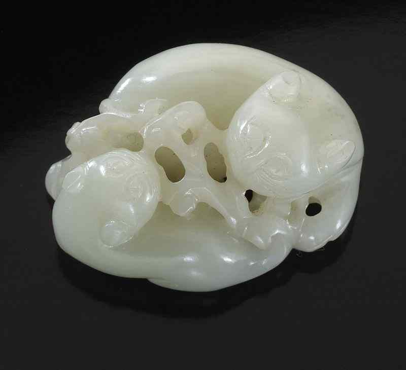 Appraisal: Chinese Qing carved white jade toggledepicting double badgers ''H x