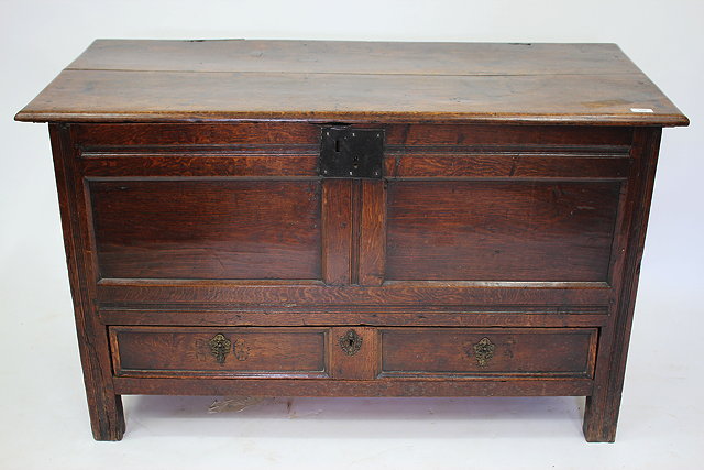 Appraisal: AN ANTIQUE OAK MULE CHEST with planked top panelled front