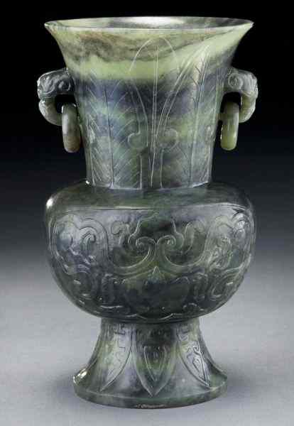 Appraisal: Chinese carved jade vasedepicting bats peaches and lingzhi ''H Circa