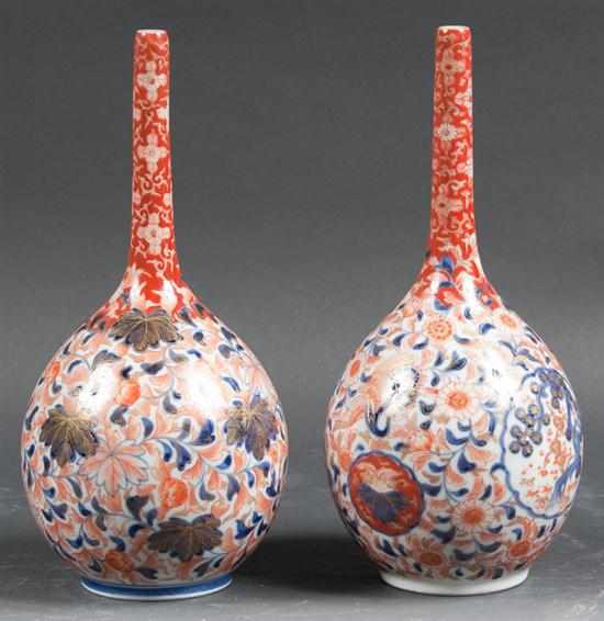 Appraisal: Pair of Japanese Imari porcelain pencil neck bottle-form vases second