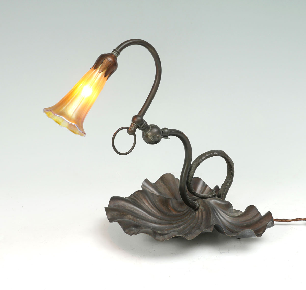 Appraisal: TH C T J CRESWICK LAMP WITH IRIDESCENT FLORIFORM SHADE