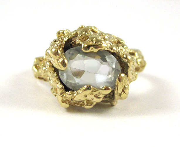 Appraisal: AQUAMARINE AND FOURTEEN KARAT GOLD RING The gold nugget setting