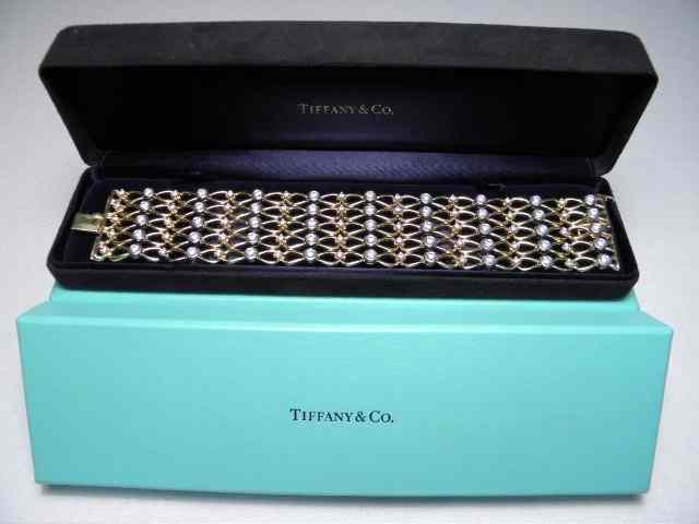 Appraisal: Tiffany Co kt yellow gold and platinum diamond ''Tailored Five