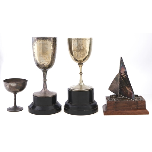 Appraisal: A silver sailing dinghy model racing trophy set on an