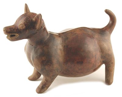 Appraisal: A pottery model of a standing dog with a burnt