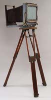 Appraisal: LARGE ANTIQUE BOX CAMERA WITH TRIPOD BY FOLMER GRAFLEX CORPORATION