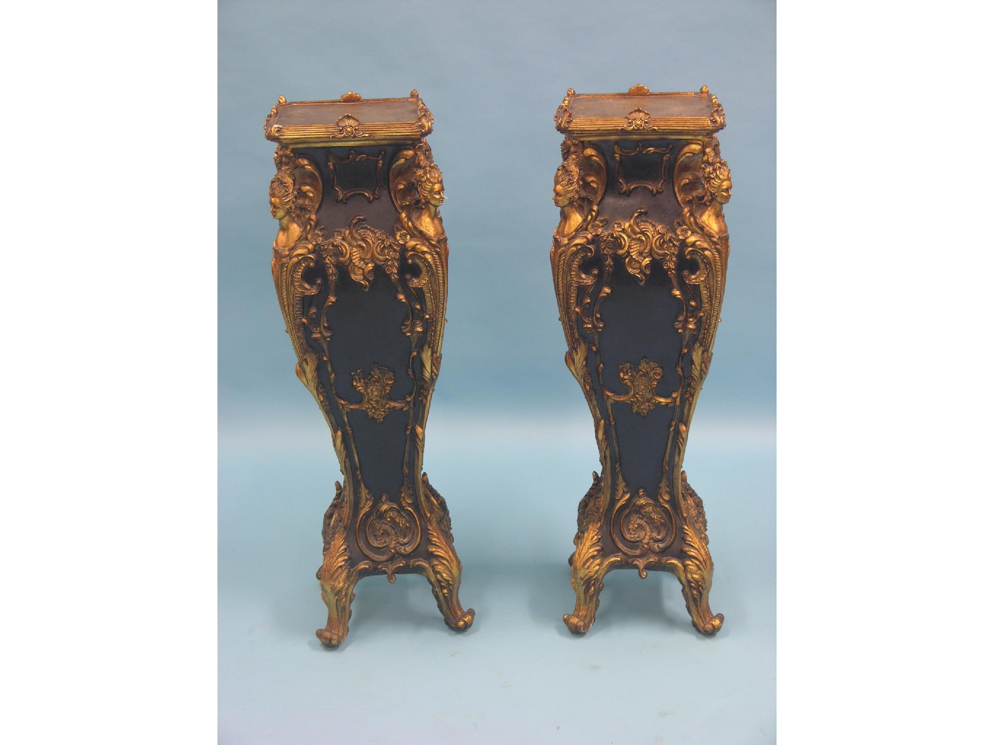 Appraisal: A pair of Louis XV-style torcheres elaborate bombe design with