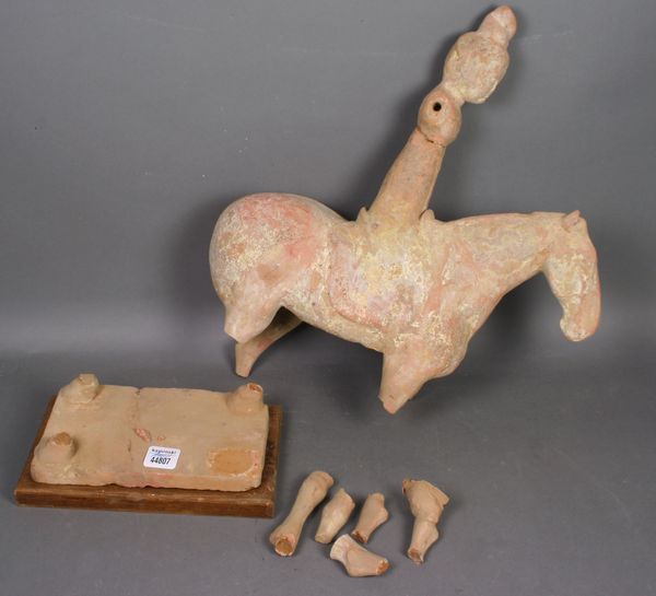 Appraisal: Han Dynasty pottery figure on horseback x Legs broken off