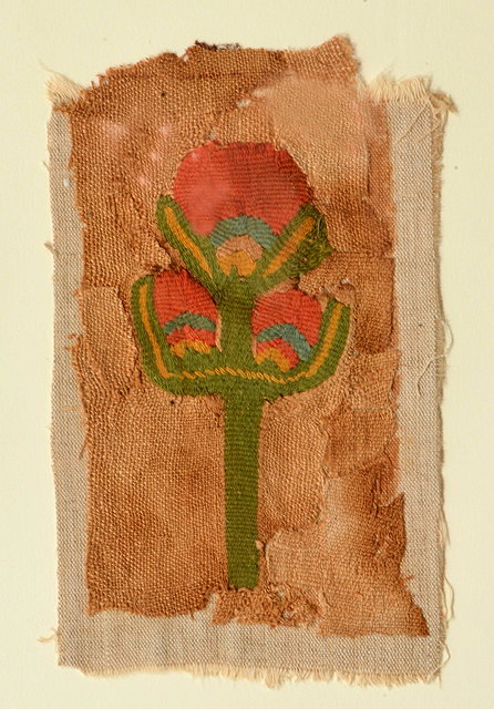 Appraisal: A TAPESTRY PANEL depicting a symbolic tree red and green