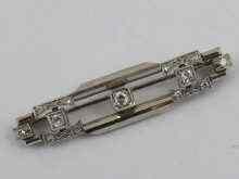 Appraisal: A ct white gold geometric design bar brooch set with