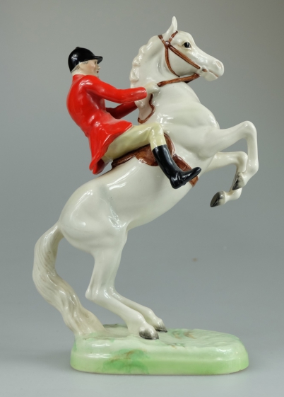 Appraisal: Beswick rearing huntsman on painted white horse