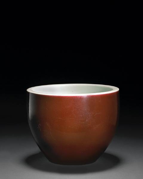 Appraisal: A copper red glazed porcelain mortar th Century Of fish