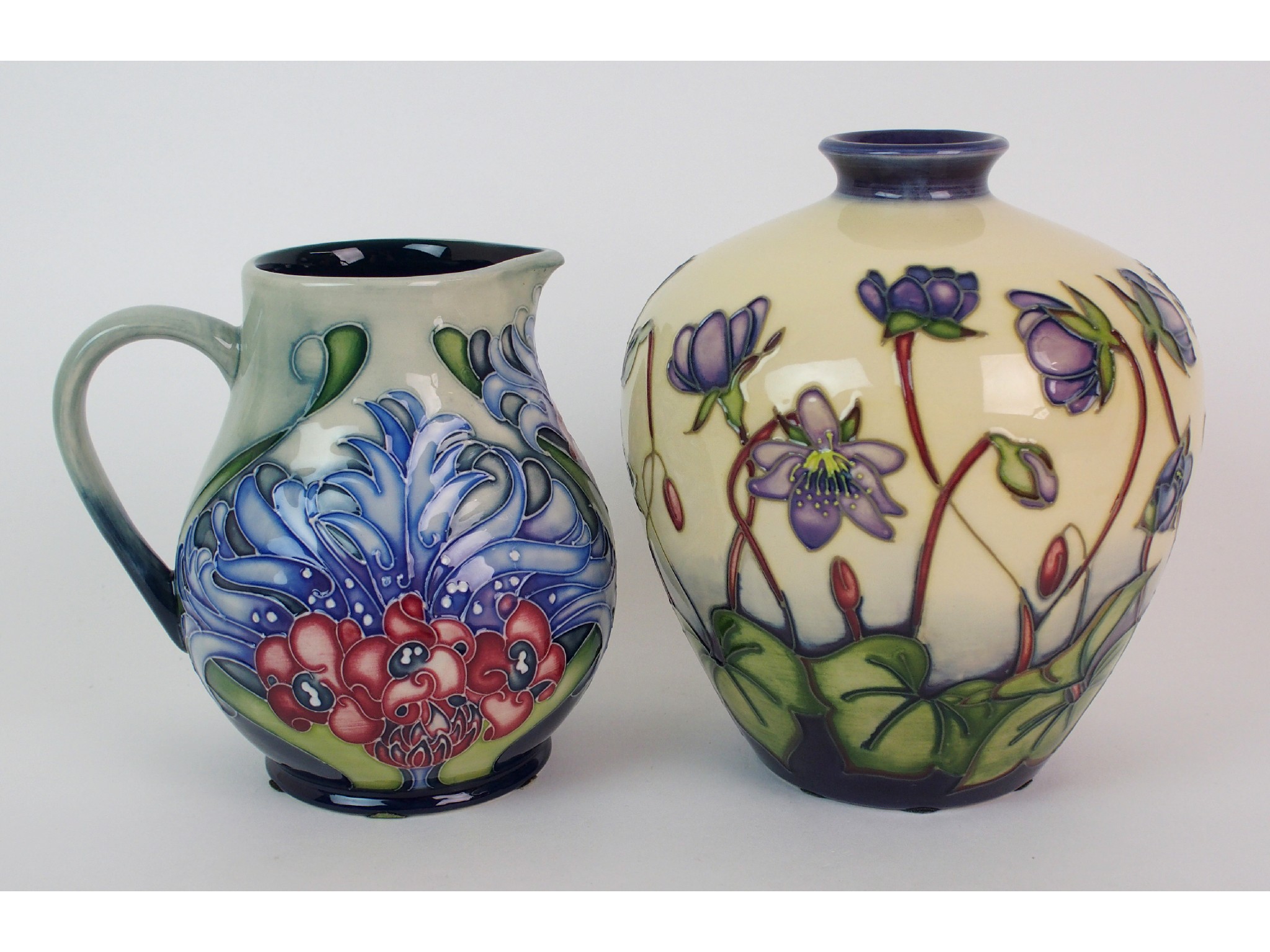 Appraisal: A Moorcroft Pottery Hepatica vase and Florian Lilac trial jugthe