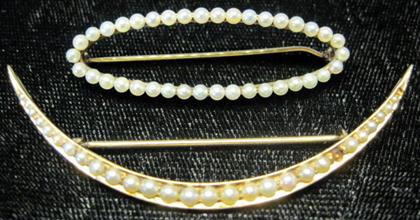 Appraisal: Two karat yellow gold pearl pinsOne crescent shaped displaying seed