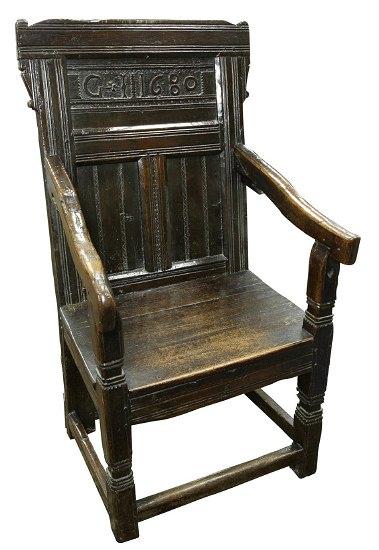 Appraisal: A Charles II oak armchair the panel back dated G