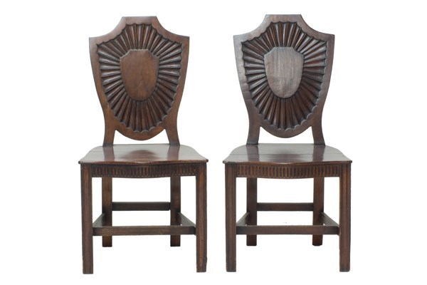 Appraisal: A pair of George III mahogany shield back hall chairs