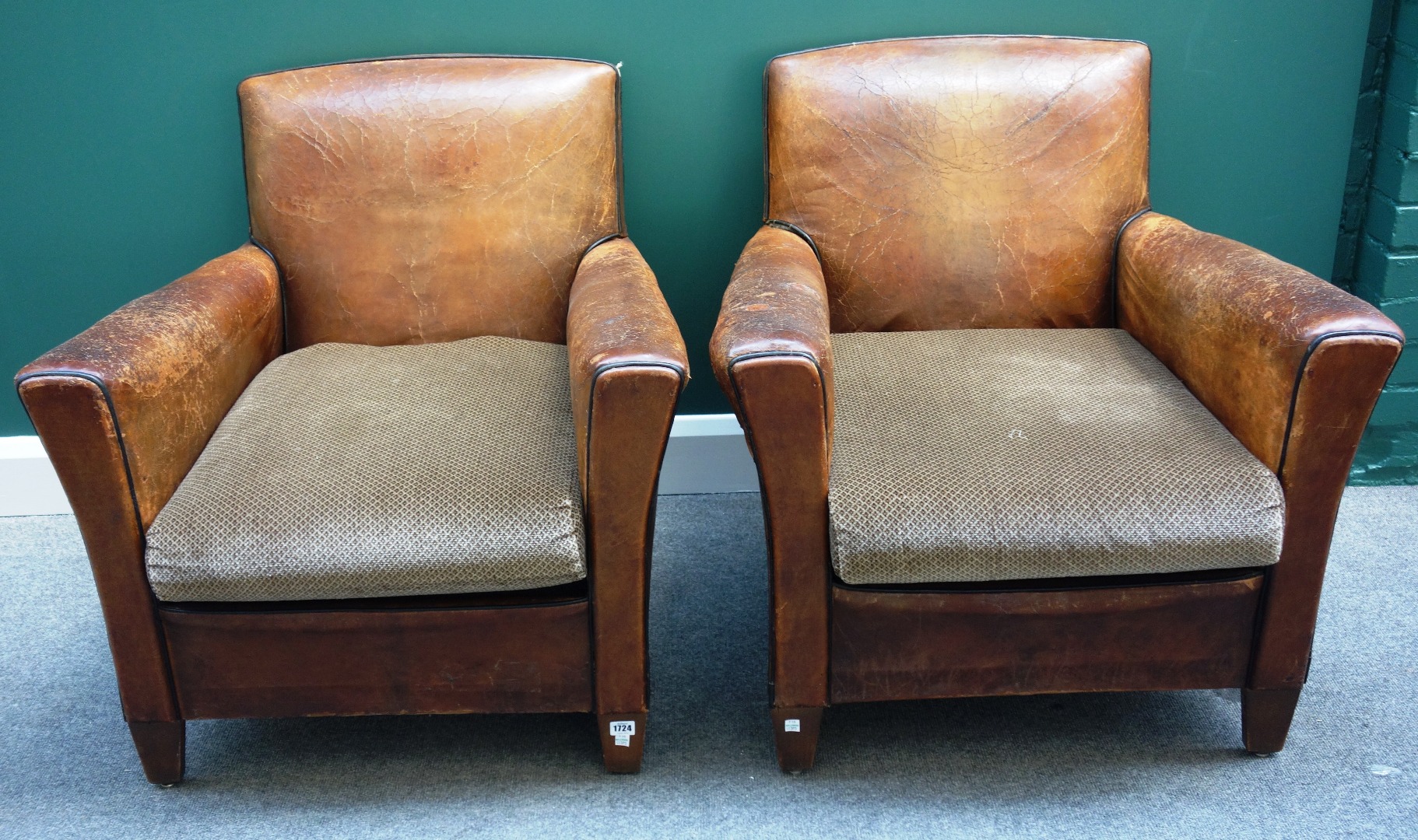 Appraisal: A pair of early th century French brown leather upholstered