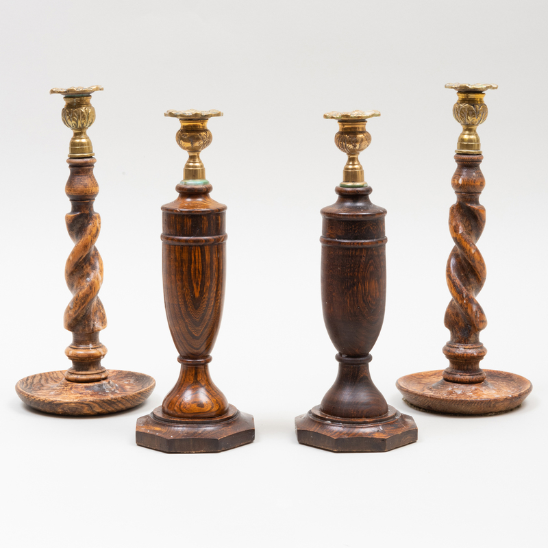 Appraisal: TWO PAIRS OF BRASS-MOUNTED ENGLISH OAK AND ELM CANDLESTICKS The