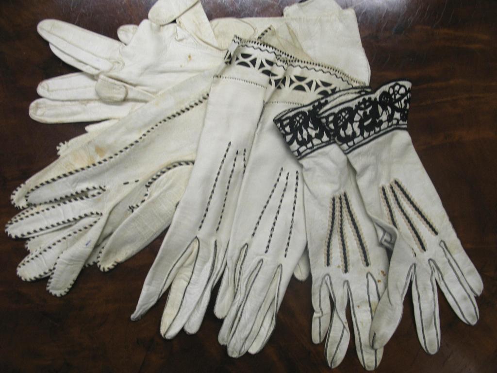 Appraisal: Four pairs of white kid skin gloves with black stitching