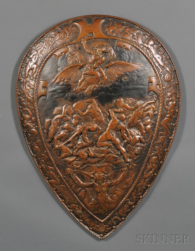 Appraisal: Decorative Iron Shield th century with bronzed repousse decoration featuring