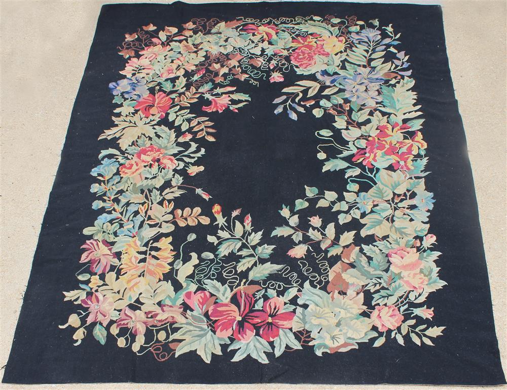 Appraisal: LARGE FLORAL NEEDLEPOINT WOOL RUG assorted flowers on a black